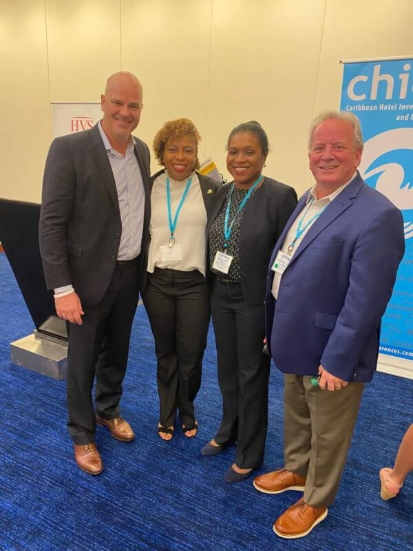 Stacy Cox, CEO, TCHTA (second from left) and Judith Garland, Legal and Compliance Officer, Invest TCI (third from left)
